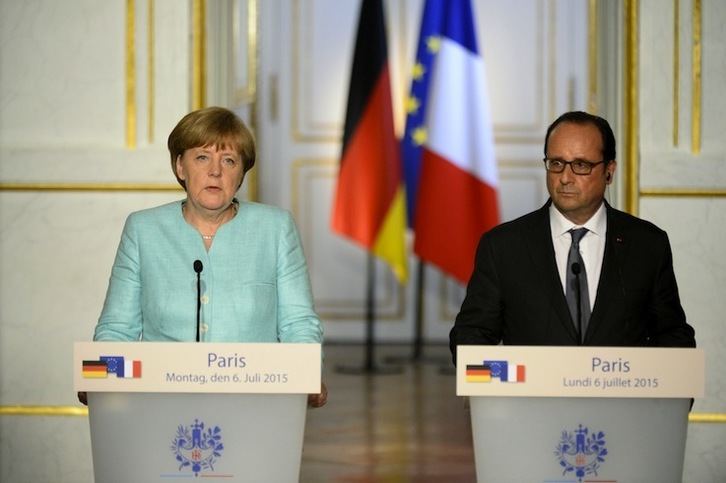 Merkel y Holllande, en una imagen de archivo. (Bertrand GUAY / AFP) 