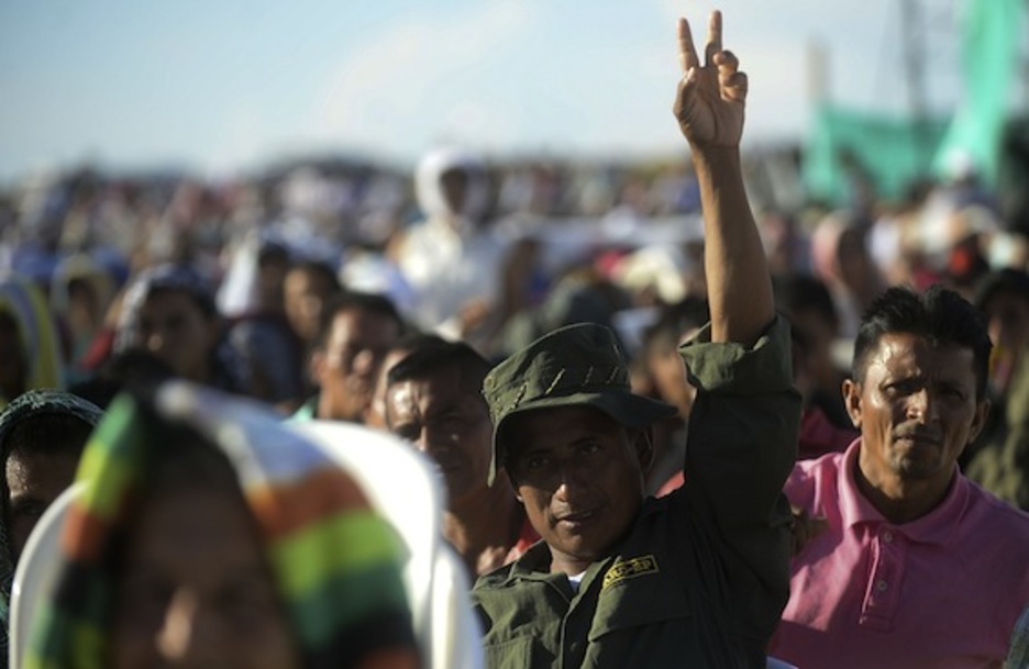 Integrantes de las FARC-EP han seguido el acto desde el campamento El Diamante. (Raúl ARBOLEDA/AFP)
