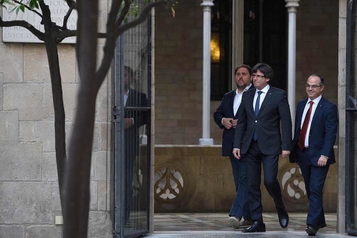 Junqueras, Puigdemont y Turull, en una imagen de archivo. (Lluis GENE/AFP)