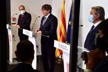 Torra, Puigdemont y Mas en su comparecencia en Perpinyà. (Raymond ROIG/AFP)
