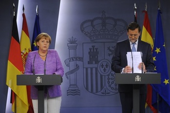 Angela Merkel y Mariano Rajoy, en la rueda de prensa posterior a su reunión. (Pierre-PhilipPe MARCOU/AFP)