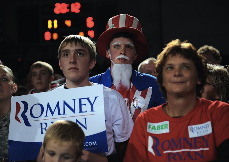 Un joven tío Sam, en campaña con Romney. (Emmanuel DUNAND/AFP PHOTO) Un joven tío Sam, en campaña con Romney. (Emmanuel DUNAND/AFP PHOTO)