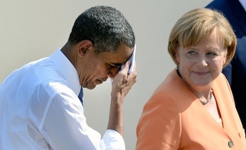 Barack Obama, junto a Angela Merkel, en una imagen de archivo. (Christoph STACHE/AFP PHOTO)