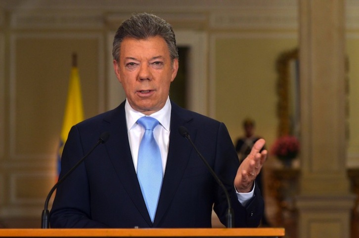 Comparecencia en la que Santos ha anunciado su decisión de optar a la reelección. (Andrés PISCOV / AFP PHOTO)