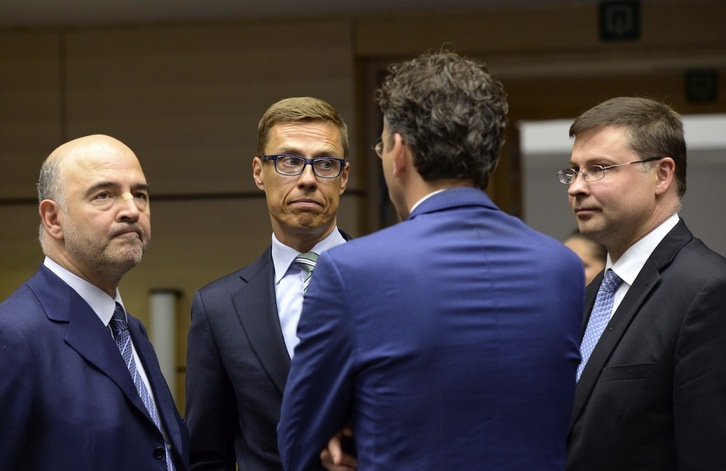 Pierre Moscovici, Alexander Stubb, Valdis Dombrovskis y, de espaldas, Jeroen Dijsselbloem. (Thierry CHARLIER / AFP) 