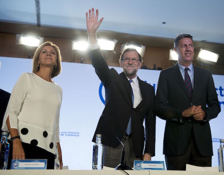 Rajoy en Barcelona, flanqueado por Cospedal y García Albiol. (Josep LAGO / ARGAZKI PRESS)
