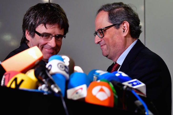 Carles Puidemont y Quim Torra, ayer en Berlín. (Tobias SCHWARZ/AFP)