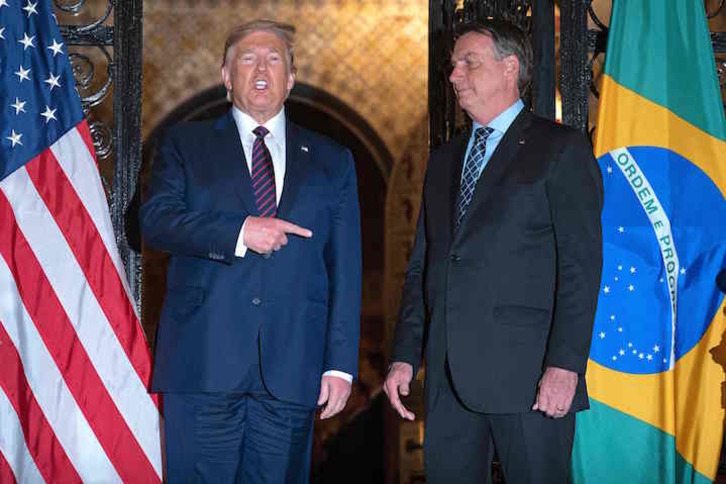 El presidente de EEUU, Donald Trump, y su homólogo brasileño, Jair Bolsonaro, defensores ambos del uso de antipalúdicos contra el covid-19 (Jim WATSON/AFP)