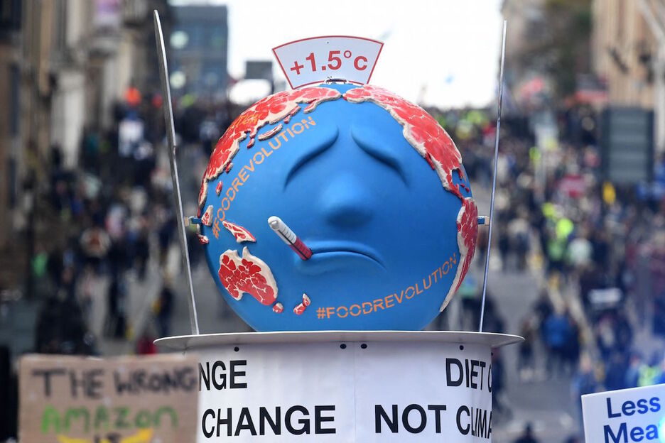 Consigna contra el calentamiento global e la manifestación de Glasgow ante la COP26. (Daniel LEAL-OLIVAS / AFP) 