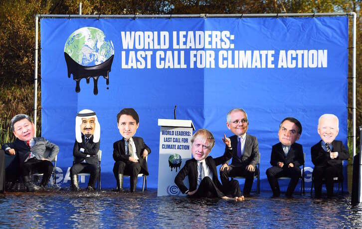 Acción, ayer en Glasgow, para reclamar a los líderes mundiales acciones más contundentes ante la emergencia climática. (Andy BUCHANAN/AFP)