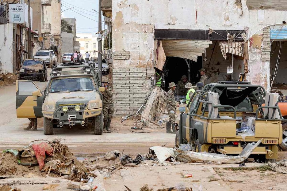  Libyan security forces patrol in Libyas eastern city of Derna.