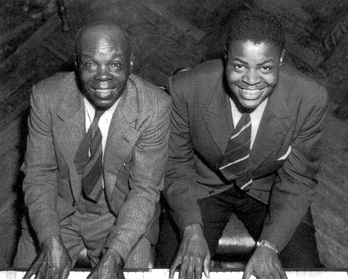 Oscar Peterson junto a su padre, Daniel Peterson.