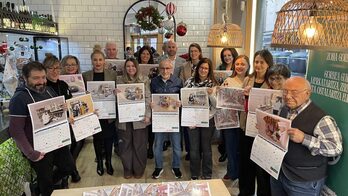 Gorbea inguruko merkatariak, egutegi berriarekin.